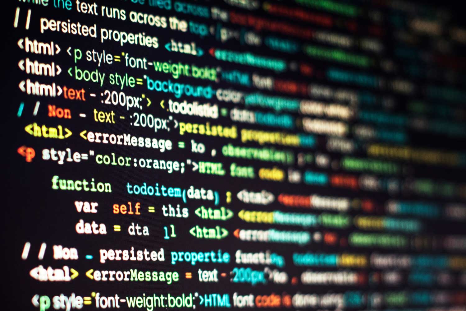 A close-up of a screen displaying code in multiple colours of text.